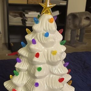 White ceramic Christmas tree. Brand new never used the lights up and works.